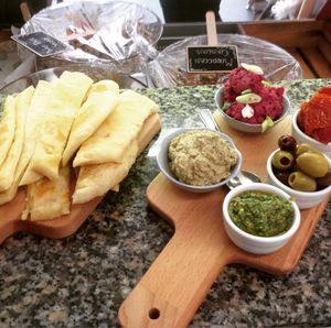 Mezze board - warm flat bread, beetroot hummus, olives, sun-dried tomatoes and fresh pesto at Nourish in Teignmouth