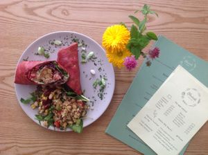 Falafels, braised red cabbage, tahini, hummus, spinach and salas all wrapped in a beetroot tortillas. Everything made fresh in house and served with house salads at Nourish in Teignmouth