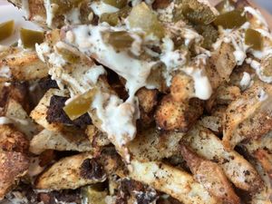 Messy Za'atar Fries
Baked fries seasoned with za'atar and cayenne, and topped with garlic cashew sauce and pickled jalapeños at Nourishmoi in Mississauga