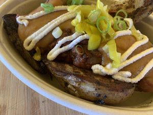 Potato chili cheese wedges with house made “cheese” sauce and cashew sour cream at Veggie Thumper - Food Truck in Des Moines