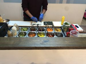 Making up 2 x burritos  at Let's Do Maki in London