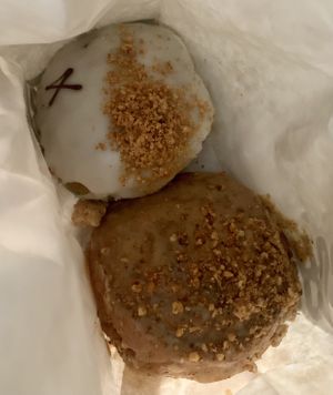 Lime & coconut doughnut and almond butter roll  at Crosstown Doughnuts - Cannon St in London