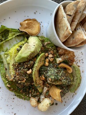 Avocado humus, baby gem, lentils and pita bread. An appetizer adapted to a main course upon request.  at U&Co. in Faro