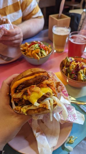 Kimchi burger, a personal fave, with a few cheeky sides (I think the bombay tots and Thai fries, both delightful)  #Veganuary at Wholesome Junkies in Manchester