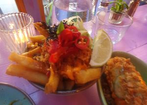 THAI FRIES - SKIN ON FRIES, S&P SALT, SWEET CHILLI, SPICY MAYO, SPRING ONIONS, CRISPY SHALLOTS, SESAME SEEDS, LIME, PICKLED CHILLIES at Wholesome Junkies in Manchester