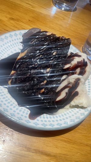 Chocolate and salted caramel cake with ice cream   at Wholesome Junkies in Manchester