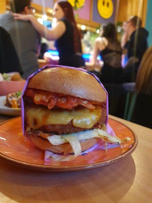 KIMCHI BURGER: MELTED CHEESE, KOREAN SOY GLAZE, KIMCHI, LETTUCE, SPICY MAYO, CRISPY SHALLOTS, ROSTI, BRIOCHE BUN. With chkn (can chose single or double 'beef') at Wholesome Junkies in Manchester