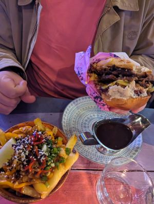 Thai fries and a festive burger with an extra patty and gravy at Wholesome Junkies in Manchester