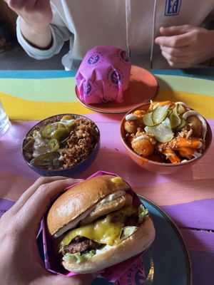 Truffle burger with mac and cheese (left) and buffalo tater tots (right)  at Wholesome Junkies in Manchester