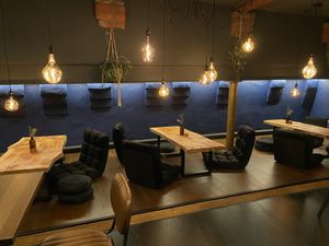 Dining in the back room with option to sit on the floor   at Wholesome Junkies in Manchester