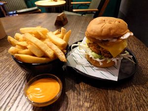Fried cauliflower burger, fries, spicy mayo at Wholesome Junkies in Manchester