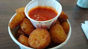 Tater tots with buffalo sauce at Wholesome Junkies in Manchester