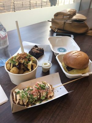 Jerk tots, biscoff brownie, needless burger and Katsu curry corn dog  at Wholesome Junkies in Manchester