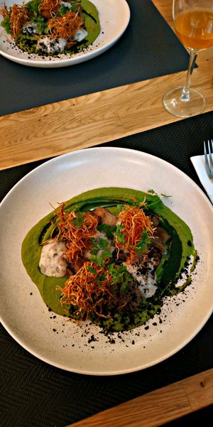 OYTER MUSHROOMS IN VEGAN DEMI GLAC Oyter mushrooms in vegan demi glace/ pea puree with mint/ crispy root vegetables/ tatar sauce at Fino in Gdansk