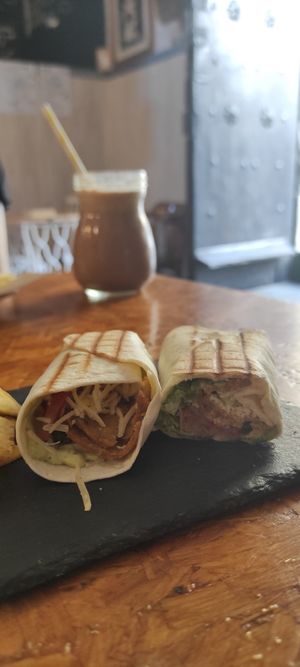 Wrap chi y al fondo batido tornado con leche vegetal at Cafe La Lola  in Gran Canaria
