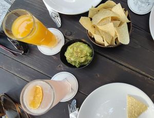 Nachos with guacamole, orange juice and pink lemonade at Orenda in Beirut