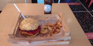 Yummy burger with fries and beer. at Flower Burger in Bologna
