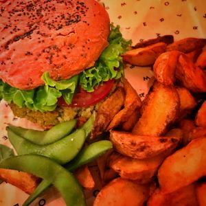 Mamma Mia vegan burger with bakes potatoes  and edamame at Flower Burger in Bologna