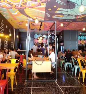 View toward counter to order and pick up food at Flower Burger in Bologna