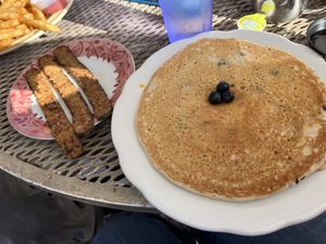 Blueberry pancakes with a side of tempeh bacun  at The Toasted Owl Cafe - Cortland Blvd in Flagstaff