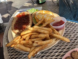 Rainbow burger (sweet potato version) with vegan cheeze and tomato jam  at The Toasted Owl Cafe - Cortland Blvd in Flagstaff