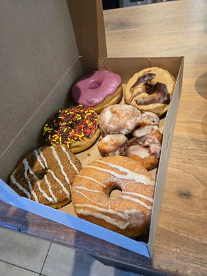 To left to right: blueberry, cookie butter, chocolate sprinkle, apple fritter, coffee, cinnamon bourbon at Pepperbox Doughnuts - Design Center  in Charlotte