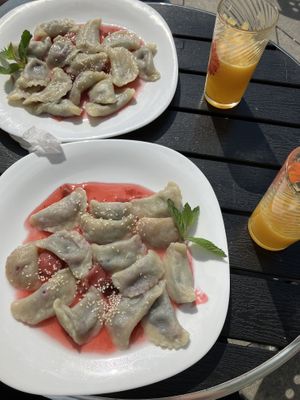 Vegan dumplings Šaltanosiai with blueberries and fresh orange juice  at Vilties Vaistinės Arbatine in Kaunas