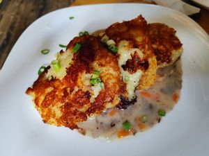 Potato pancakes with mushroom sauce at Vilties Vaistinės Arbatine in Kaunas