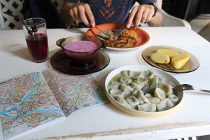 Cold beetroot soup, dumplings with mushrooms, potato pancakes with mushroom souse and homemade iced tea  at Vilties Vaistinės Arbatine in Kaunas