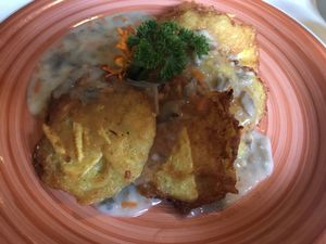 Potato pancakes with mushroom sauce at Vilties Vaistinės Arbatine in Kaunas