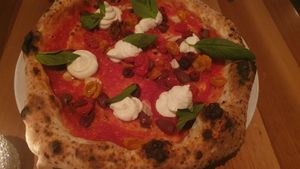 confit date tomatoes, olives, vegan ricotta, basil at Piu - Schiffbau in Zurich