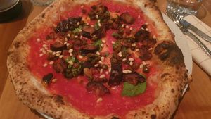 Eggplant, pine nuts, capers, sultanas, basil at Piu - Schiffbau in Zurich