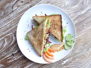 vegan Tempeh & Tofu Sandwich: green Lettuce, fried Tofu, fried Tempeh, Beetroot and Cucumber with spicy balinese Peanut Sauce at Deanna Day Spa in Seminyak