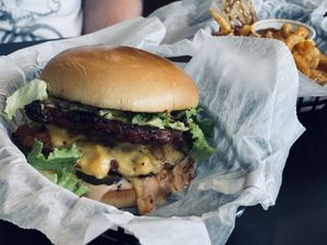 Anarchy burger with curly fries and bbq sauce at Seitan's Realm in Columbus