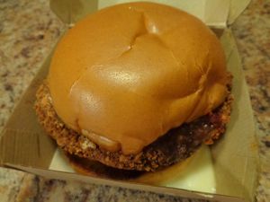Chikun Parm to go.  House-made chikun patty on top of a toasted brioche bun, smothered in mozzarella cheeze and marinara sauce. Crispy and flavorful breading and the perfect chew to the patty. 
 at Seitan's Realm in Columbus