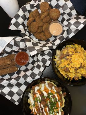 Jess’s Mess (bottom), Mozzarella sticks (left), fried pickles (top), chicken special plate (right)  at Seitan's Realm in Columbus