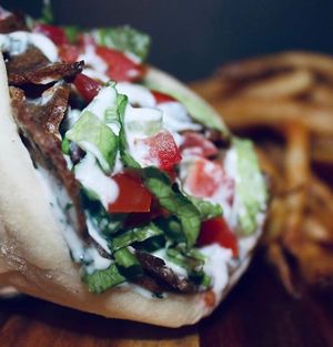 Gyro
Thinly sliced gyro beaf, topped with lettuce, tomato, and homemade tzatziki sauce served on warm pita bread at Seitan's Realm in Columbus