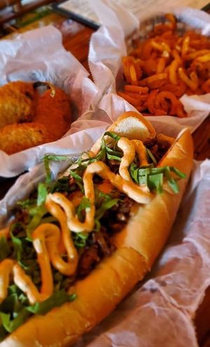 Cheezestake
Thinly sliced beaf marinated in rosemary and garlic topped with caramelized onions, gooey cheeze sauce, garlic mushrooms, lettuce, and homemade chipotle aioli sauce,  at Seitan's Realm in Columbus