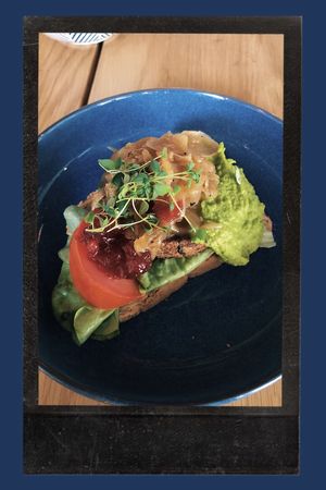 Bean and seaweed burger with baked onions, pea purée and lingonberry jam 🥪 at FRØ in Tromsoe