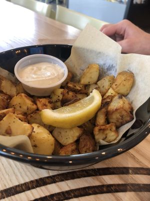 Copper cubes (oven roasted potatoes house spice and garlic aioli)   at Copper Branch - 16th Ave in Calgary
