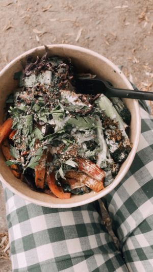 Sourdough bread with hummus, tahin and krautenöl, the bread is hidden under all the veggies. So good!! at ÆNDRÈ in Hamburg