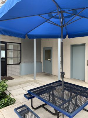 Across the courtyard to the bathroom  at Retrograde Coffee Roasters in Sebastopol