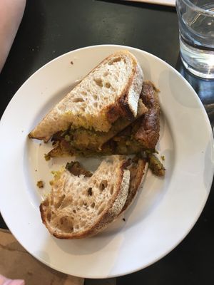 Vegan Breakfast Sandwich- half portion of vegan frittata at Retrograde Coffee Roasters in Sebastopol