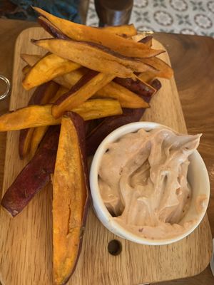 Sweet potato fries alongside vegan mayo  at The Source Cafe in Siem Reap