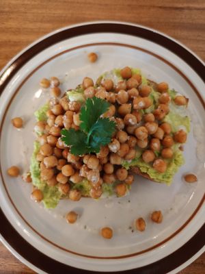Vegan breakfast: Avocado, Chickpeas, Tahini, Bread at The Source Cafe in Siem Reap