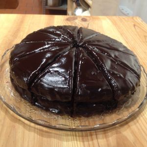 Chocolate cake with blueberry jam! Gluten free, sweetened with dates and maple syrup. Full of nutrients = made out of almond and buckwheat flour. at Yoga Cakes in Amersfoort