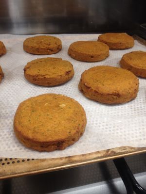 Lentil and quinoa burger patties with carrots, celery, thyme and flax meal. Gluten free. at Yoga Cakes in Amersfoort