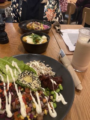 Bubble and squeak cakes. Vegan truffle tots. Burrito bowl. Pineapple, hibiscus, mango and coconut milk fruit shakes.   at BEAR in Derby