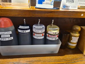 Clearly labelled sauces at Menkui Kinya in Kyoto