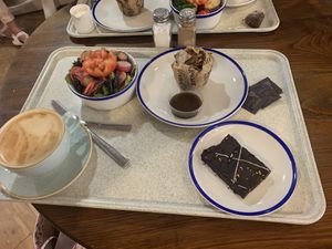 Mushroom nut roast with a bowl of salad and vegan dressing, chocolate orange vegan brownie and oat milk latte. Delicious!  at Webbs in Droitwich Spa